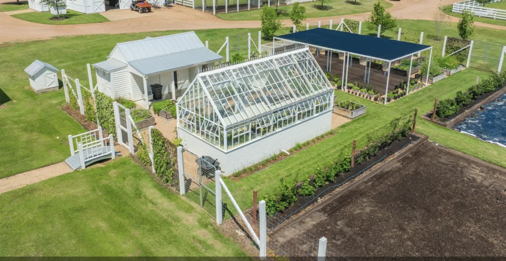 The garden shed, covered growing plot, and greenhouse at Goodthyme Farm ideal for growing vegetables and flowers year-round. (Photo by Michael McNamara of ZenHouse Collective)